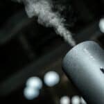 Mist rising from a sleek humidifier