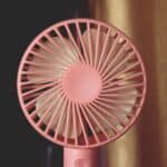 an upclose handheld fan