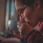 someone drinking coffee