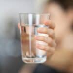 someone drinking water for hydration