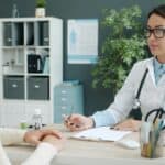 talking with doctor in office