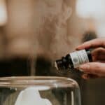 essential oils being put into diffuser