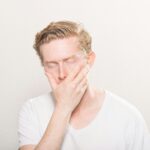 someone with nausea eyes closed