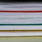 stacked papers on table