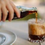 a soda pouring over ice