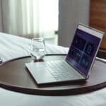 a bed tray with laptop