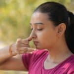 a woman with nasal congestion