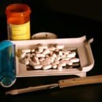 a pill dispenser being filled
