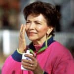 a woman applying sunscreen